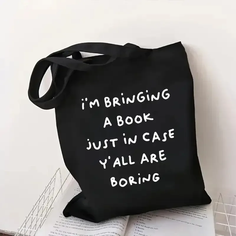 sac fourre-tout en toile imprimé double face 1a, fond noir avec texte blanc, matériau en polyester durable, très adapté pour les livres.