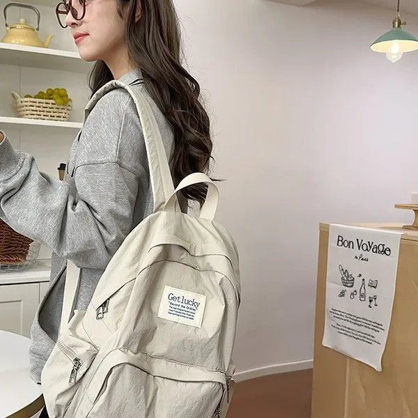 nouveau sac à dos de voyage décontracté pour femme 2025 – léger, grande capacité, imperméable en nylon, double bretelle, style frais et doux 14