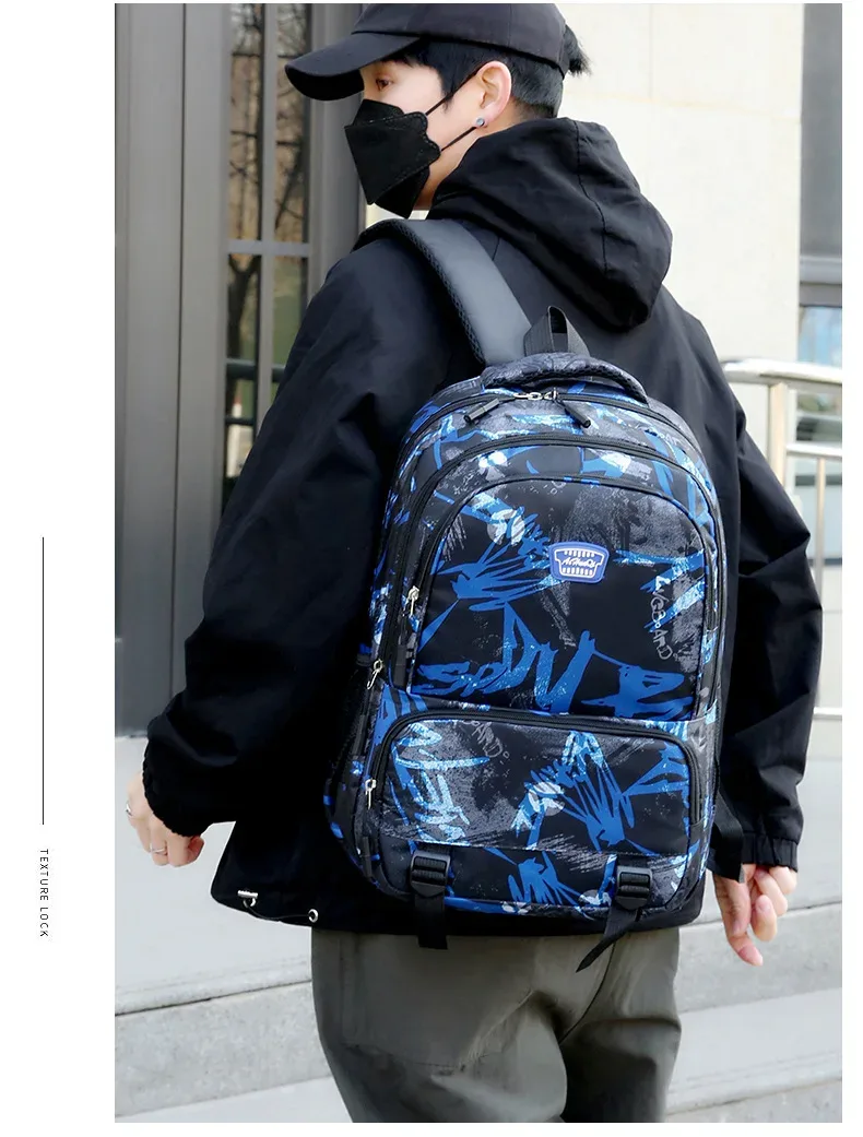 nouveau sac à dos en tissu oxford pour hommes et femmes, sac à dos de voyage à motifs camouflage, sacs pour collège, lycée et école primaire.
