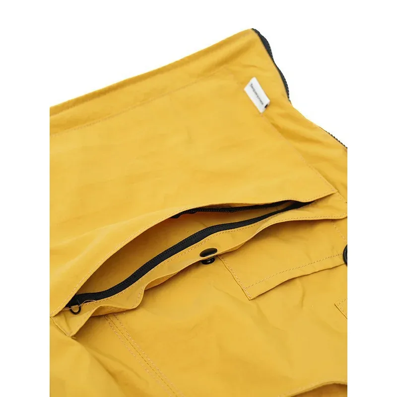 sac dos nylon jaune vert rose poches ouvertes bandoulière arquée fermeture éclair capacité inferieure deuxize litres usage voyage décontracté jacquard