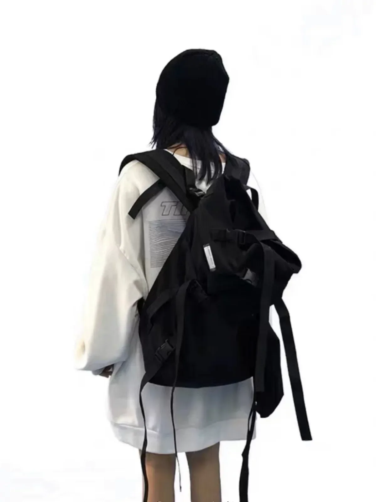 sac dos nylon noir forme trapézoïdale bandoulière arquée chaîne intérieur informatique moto rubans capacité grand voyage