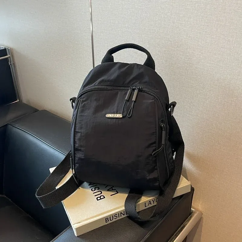 mini sac à dos multifonctionnel en nylon, sac de voyage convertible décontracté à bandoulière pour femme, sac à dos quotidien multi-poches pour l'extérieur