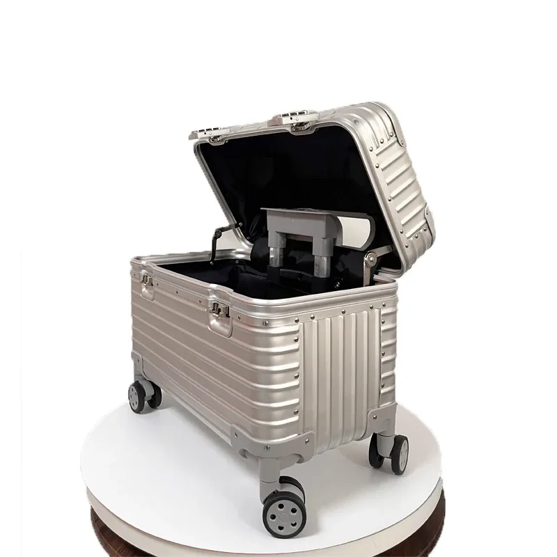 valise aluminium argent doré beige toupie roulettes poignée plaque centrale gris voyage business week-end