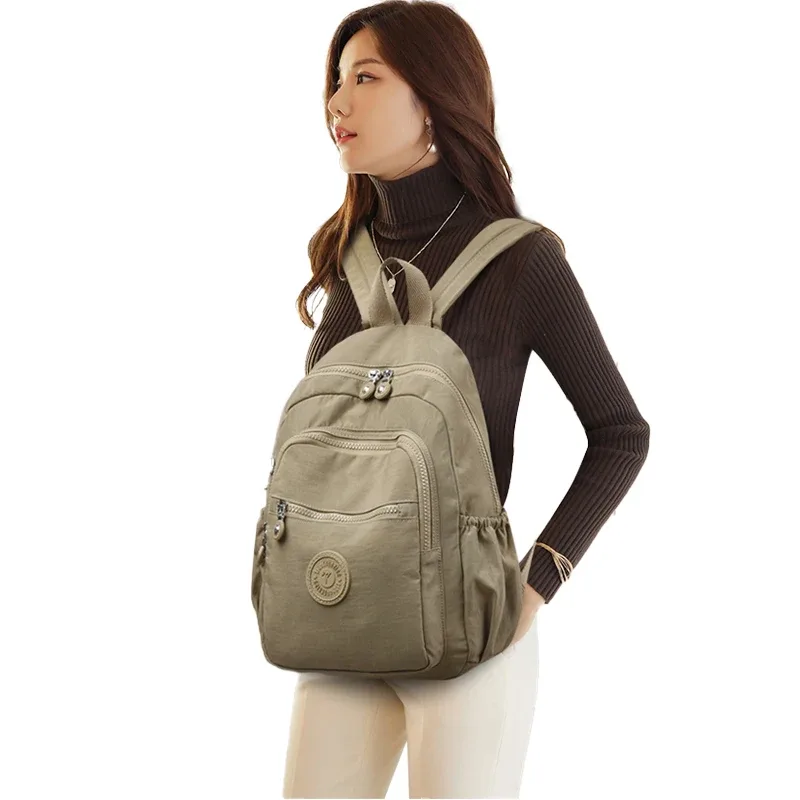 sac dos nylon unisexe noir poche latérale fermeture éclair doublure beige imprimé usage journalier