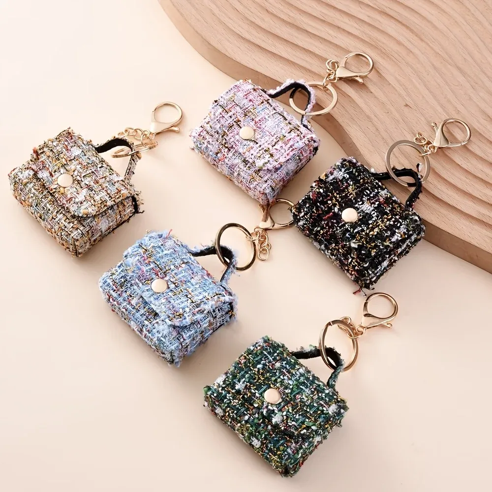 porte clés sac mini tweed bleu rose noir poignée métallique dorée monnaie écouteurs accessoire voyage compact
