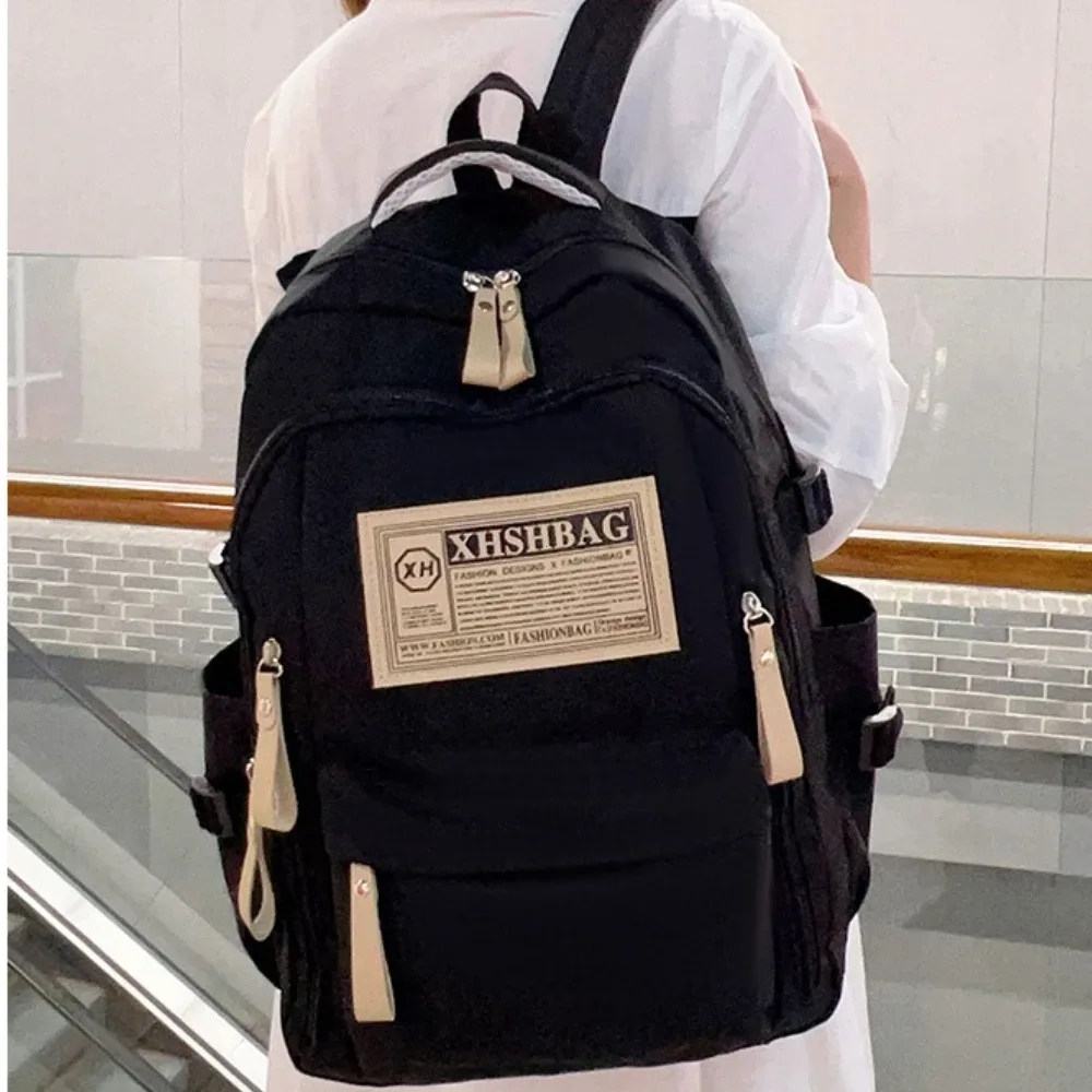sac dos nylon solide beige rouge noir kaki décontracté poignée souple fermeture éclair usage journalier