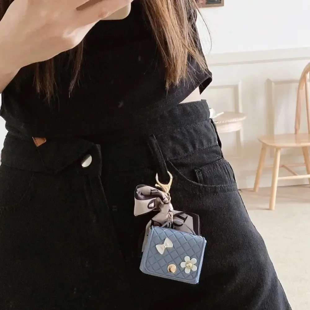 nouvelle pochette de rangement en cuir 2026 pour écouteurs, mini porte-clés créatif, pendentif couleur unie, étui pour écouteurs bluetooth