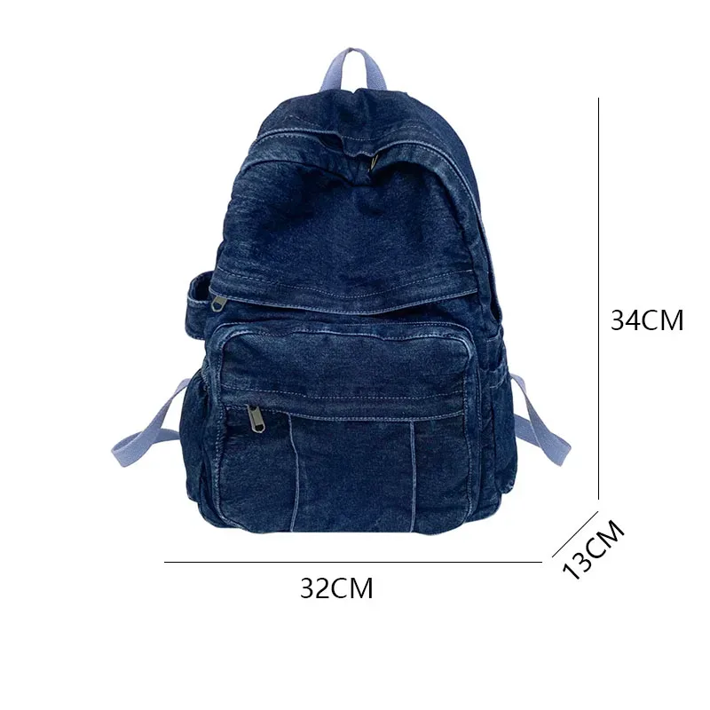 sac dos jean bleu denim cuir marron poche avant zippée bandoulières souplement détendu usage voyage école quotidien transport ordinateur portable