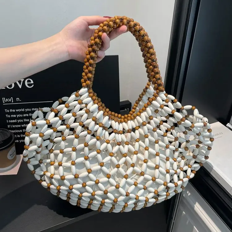 sac à main féminin fait main en perles, sac de plage tissé pour femmes, design exquis, sac seau creux en perles de bois, sac à bandoulière.