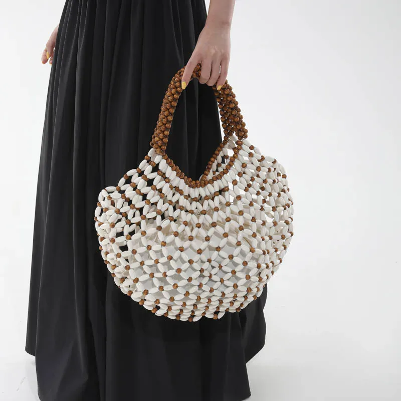 sac à main féminin fait main en perles, sac de plage tissé pour femmes, design exquis, sac seau creux en perles de bois, sac à bandoulière.