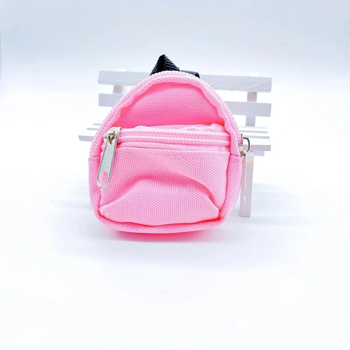 sac dos nylon petit format ovale fermeture glissière poche latérale double épaule poches latérales couleur vivante usage voyage