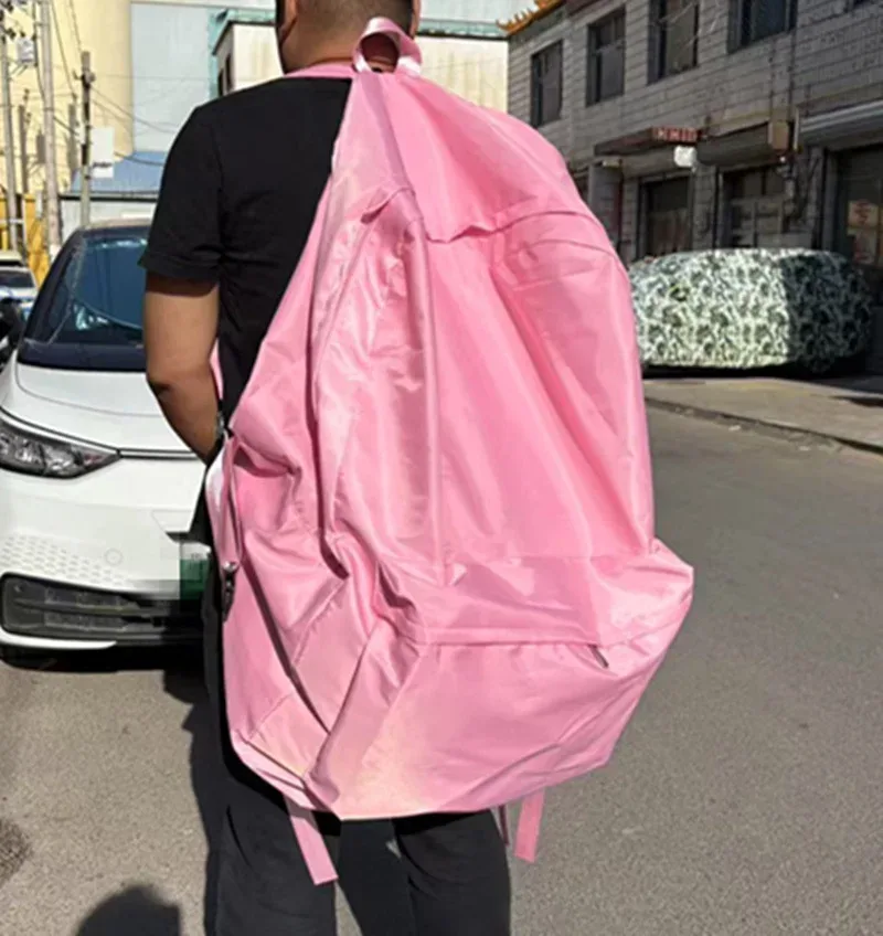 sac dos polyester violet vert bleu rouge jaune rose forme trapézoïdale poches latérales fermeture glissière usage voyage grande capacité