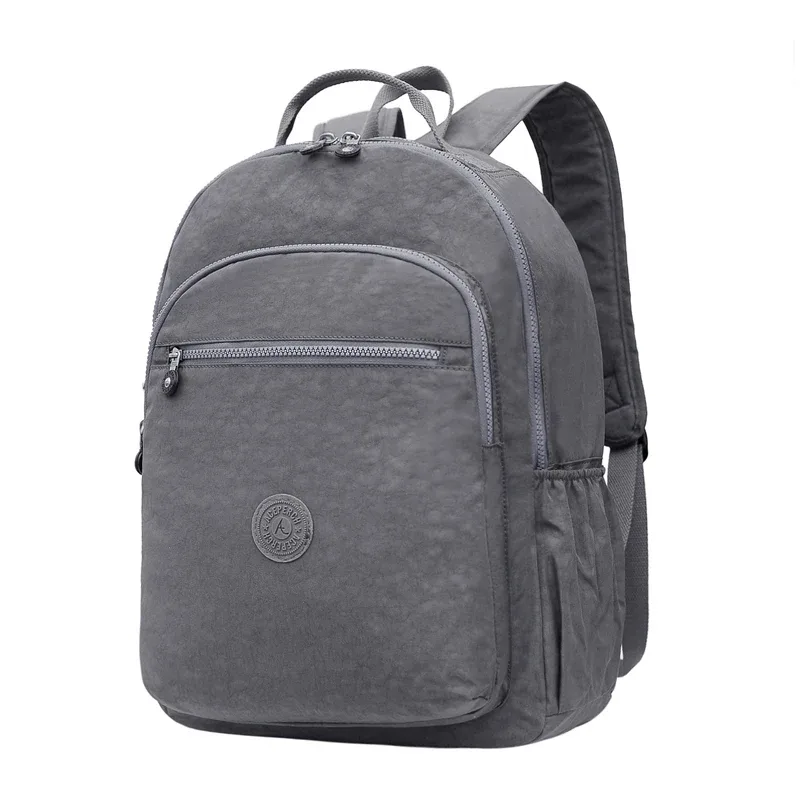 sac dos nylon gris anthracite compartiments poches latérales glissière accessoires pompon porte monnaie voyage école adolescente