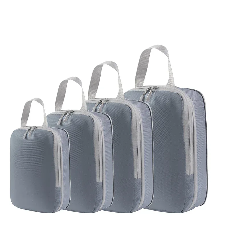 organisateur voyage polyester blanc bandes grises format rectangulaire poignées grises compression vêtements articles toilette rangement valise