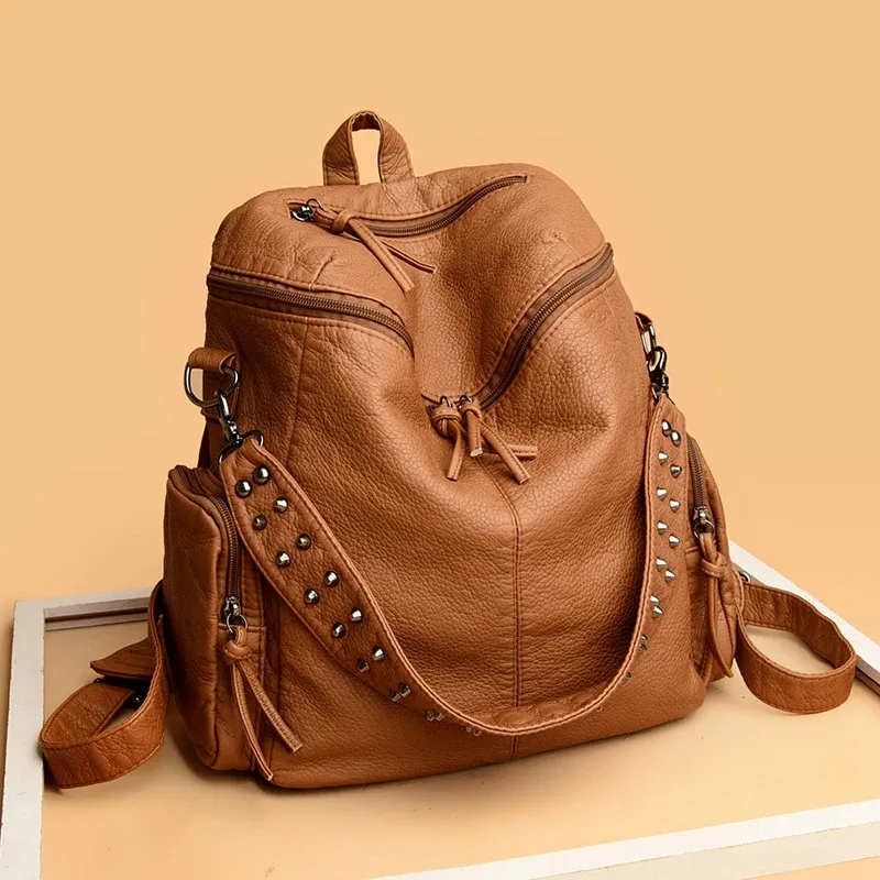 sac dos cuir souple polyester bleu noir gris marron poche ouverte fermeture éclair bandoulière arquée usage voyage femme décontracté