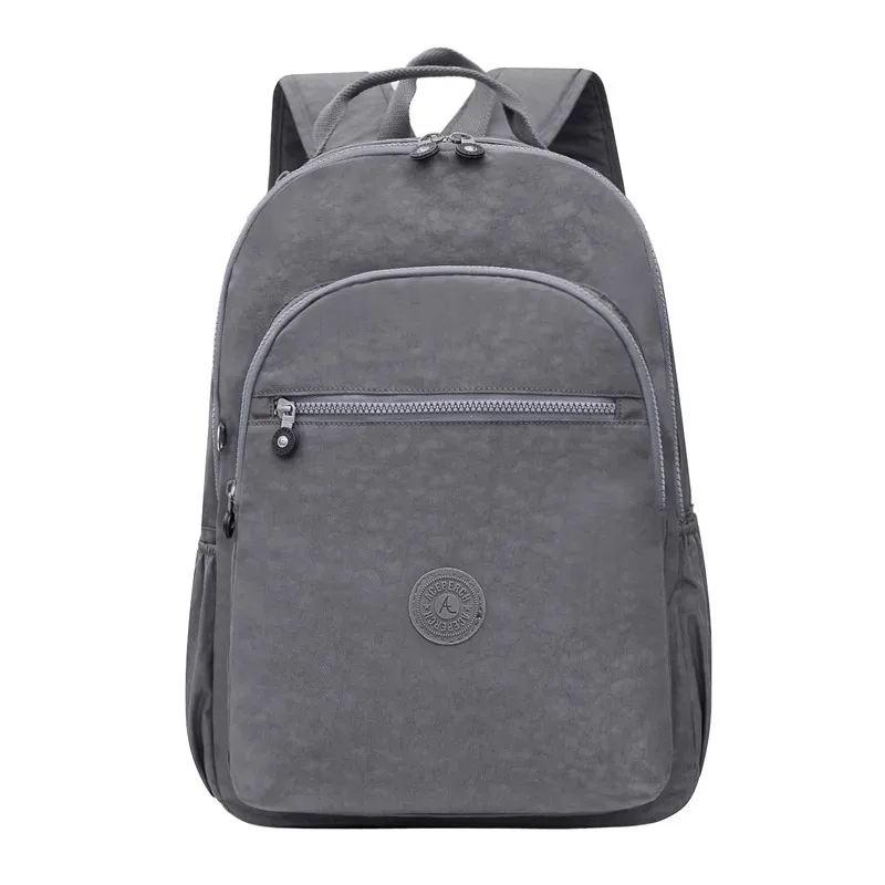 sac dos nylon gris anthracite compartiments poches latérales glissière accessoires pompon porte monnaie voyage école adolescente