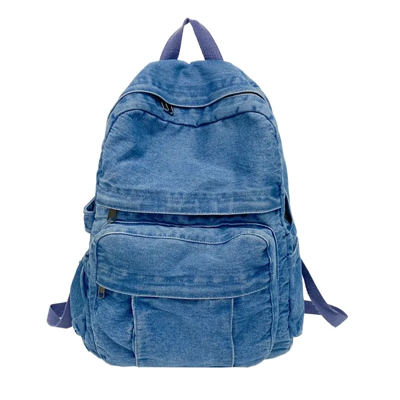 sac dos jean bleu denim cuir marron poche avant zippée bandoulières souplement détendu usage voyage école quotidien transport ordinateur portable