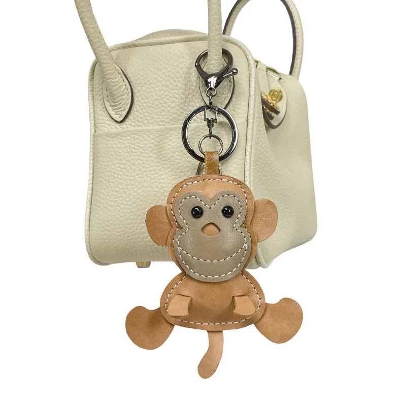 nouveau mignon singe en cuir de vache porte-clés mini hommes et femmes sac à main pendentif à la mode porte-clés sac à bagages pièces accessoires