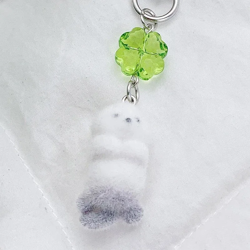 breloque de téléphone anime mignonne en forme de loutre, pendentif caméra trèfle à quatre feuilles kawaii, porte-clés tendance et élégant, décoration pour sac à dos, cadeau