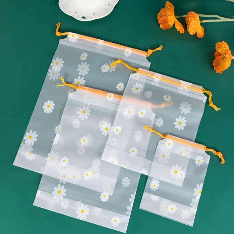 organisateur voyage transparence motif fleurs blanches fond gris corde jaune nylon plastique petit moyen grand