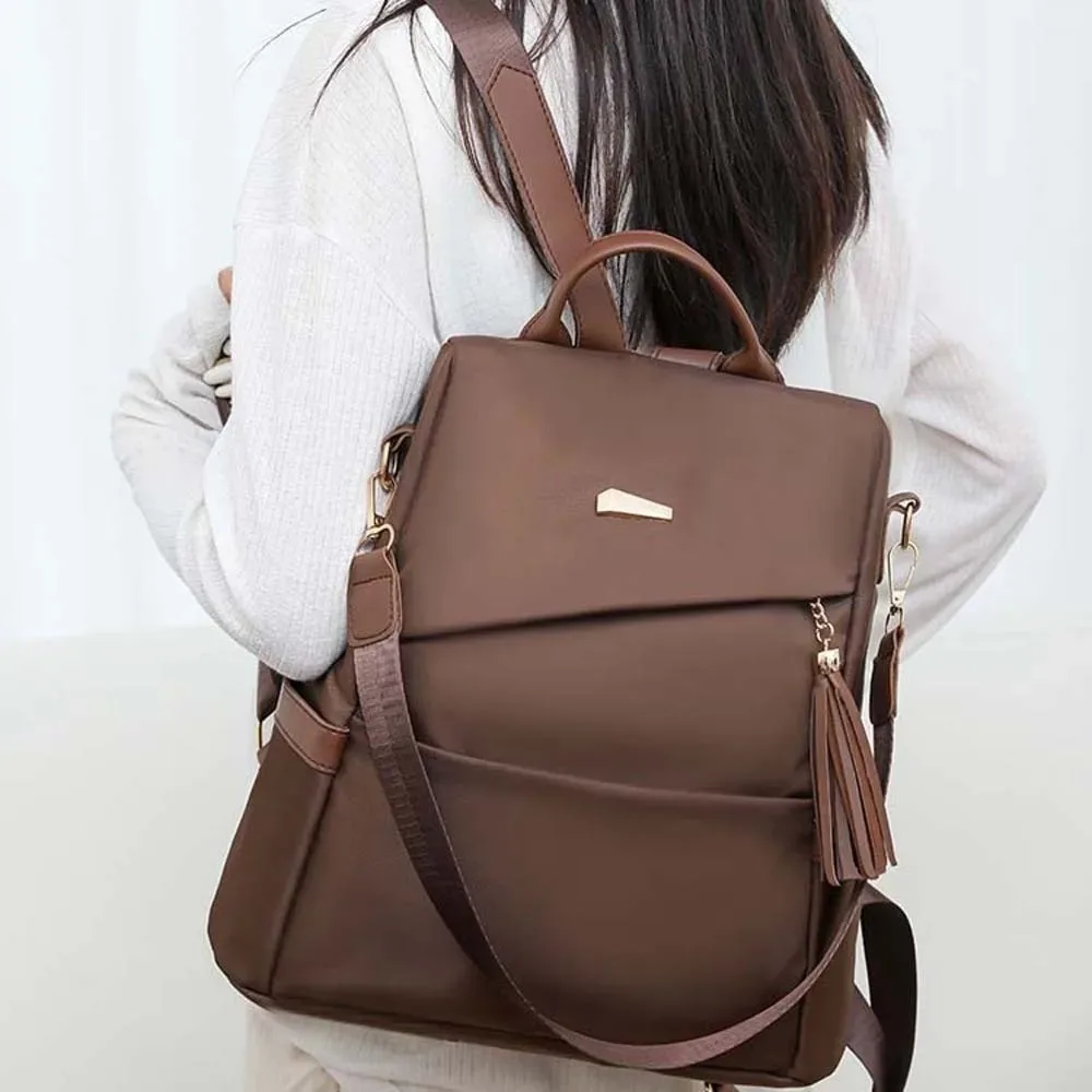 sac à dos en nylon de grande capacité pour femmes, sac à dos imperméable de couleur unie, doux au toucher, multi-poches, avec pompon décoratif, sac à dos antivol