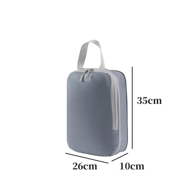 organisateur voyage polyester blanc bandes grises format rectangulaire poignées grises compression vêtements articles toilette rangement valise