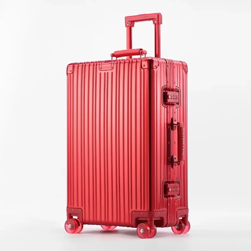 valise aluminium argenté roulettes oranges toupies ergonomiques poignées verticales voyage affaires élégante robuste durables