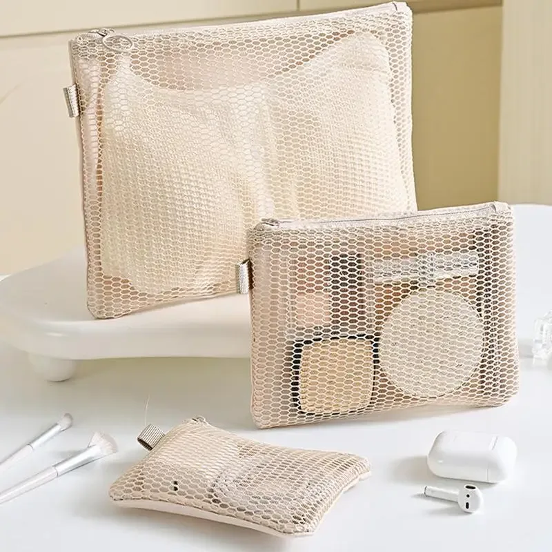 trousse de toilette portable transparente en maille grande capacité, pochette cosmétique en filet pour le rangement du maquillage en voyage pour femmes