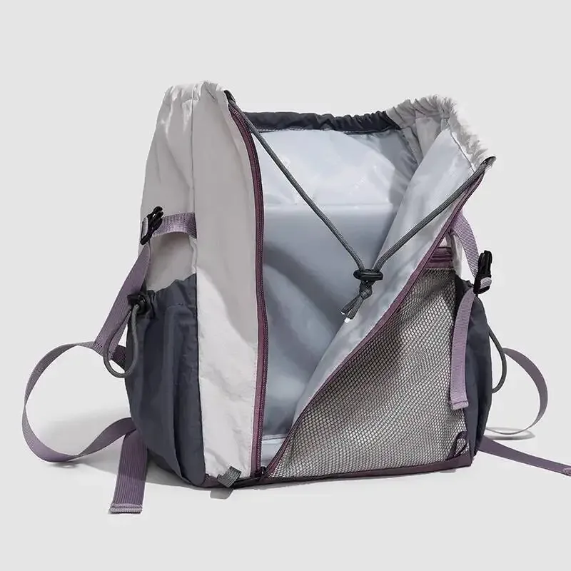 sac dos nylon noir poche zip latérale maille grise bretelles bandes logo blanc style voyage capacité litres