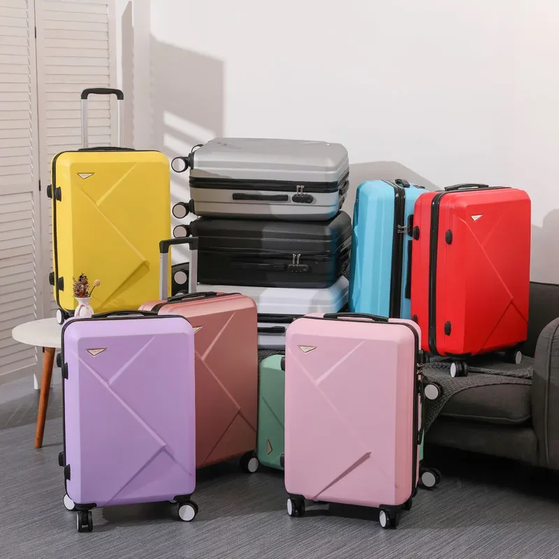 valise abs plastique dur motif géométrique lignes diagonales relief gris rose blanc jaune vert bleu rouge bagage affaires voyage