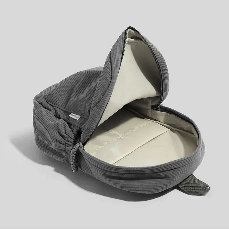 sac dos velours cotelé gris compartiment intérieur bandoulière arquée fermeture éclair usage etudiant femmes