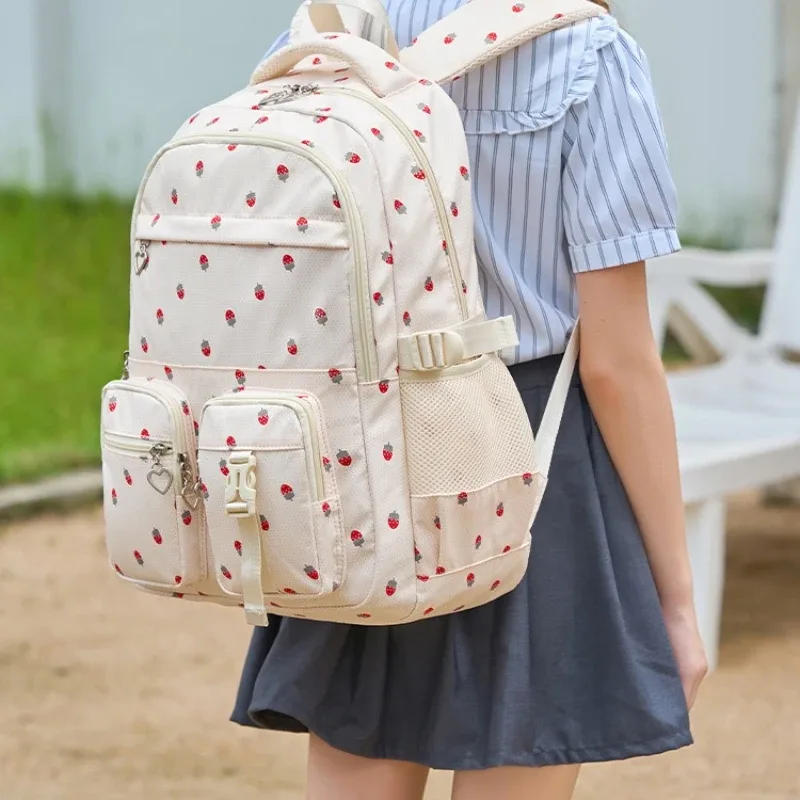 sac dos nylon fraise rouge blanc rose violet beige imperméable bandoulière poche téléphone voyager école
