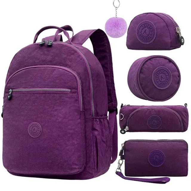 sac dos nylon gris anthracite compartiments poches latérales glissière accessoires pompon porte monnaie voyage école adolescente