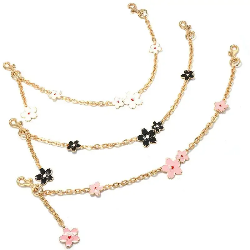 bracelet extensible zinc motif fleur coeur décoration sac femmes chaîne ornementation multifonction usage jour personnalisation style chic mode transport