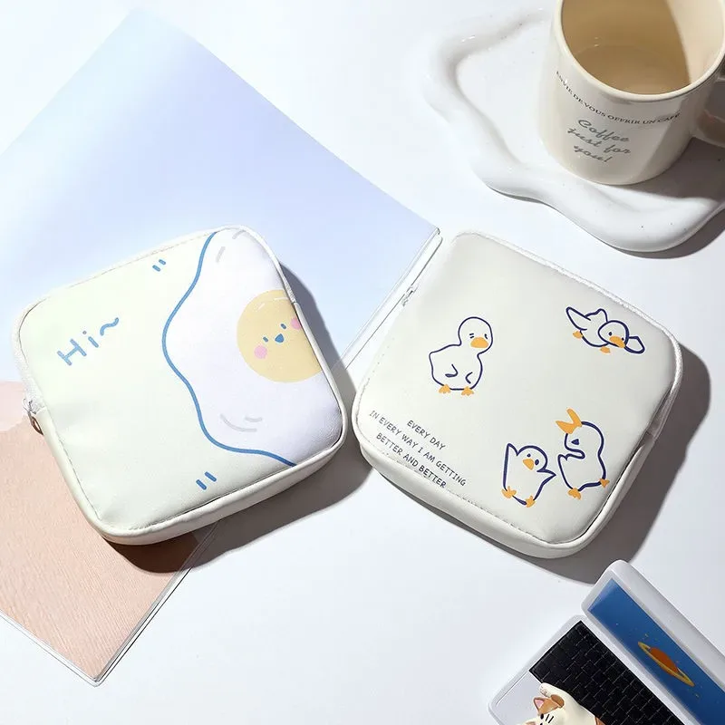 pochette de rangement pour serviettes hygiéniques, motif dessin animé mignon, mini organisateur portable à fermeture éclair pour femmes, pour serviettes, maquillage et petits objets.