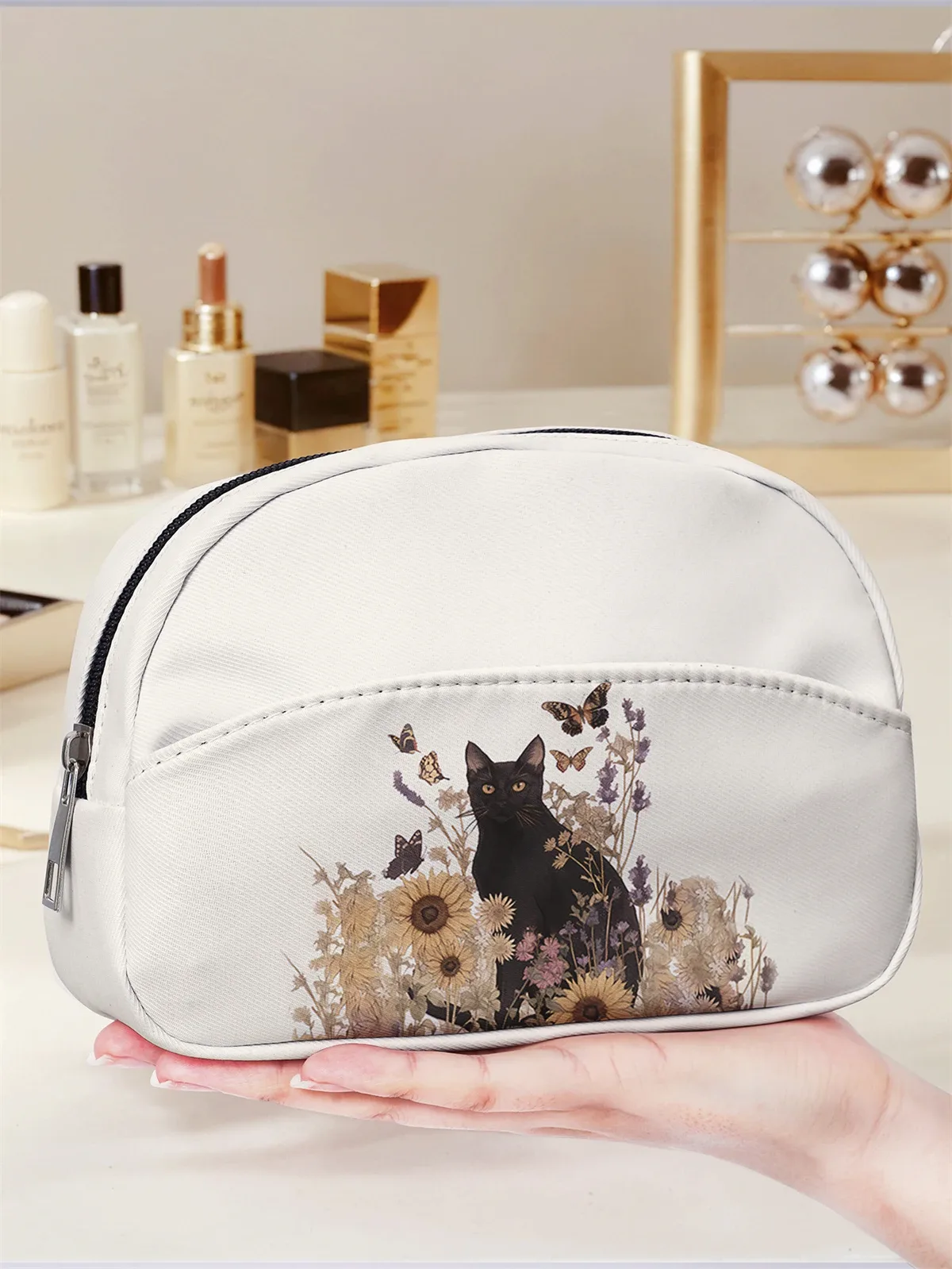 trousse de maquillage art nouveau à motif floral blanc et chat noir, avec fermeture éclair, pour le rangement des articles de toilette en voyage.