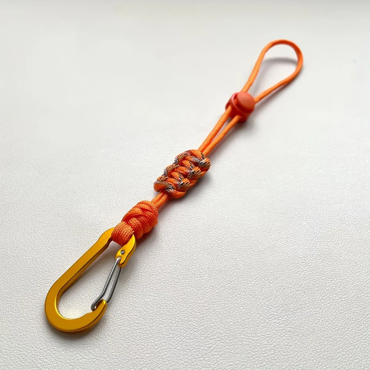 porte bouteille cordon paracord boucle métal nœud décoratif voyage randonnée jaune noir orange violet marron