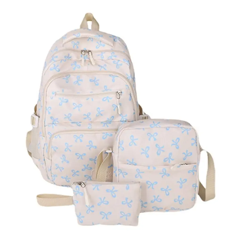 sac dos polyester motifs nœuds blancs fond noir beige deux petits sacs accessoires usage voyage école