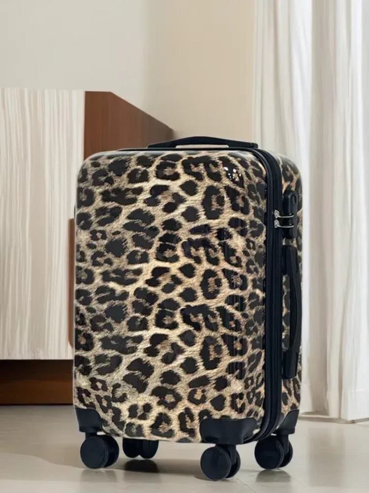 valise motif léopard beige roulettes noires poignée supérieure compartiments intérieur gris clair voyage femme