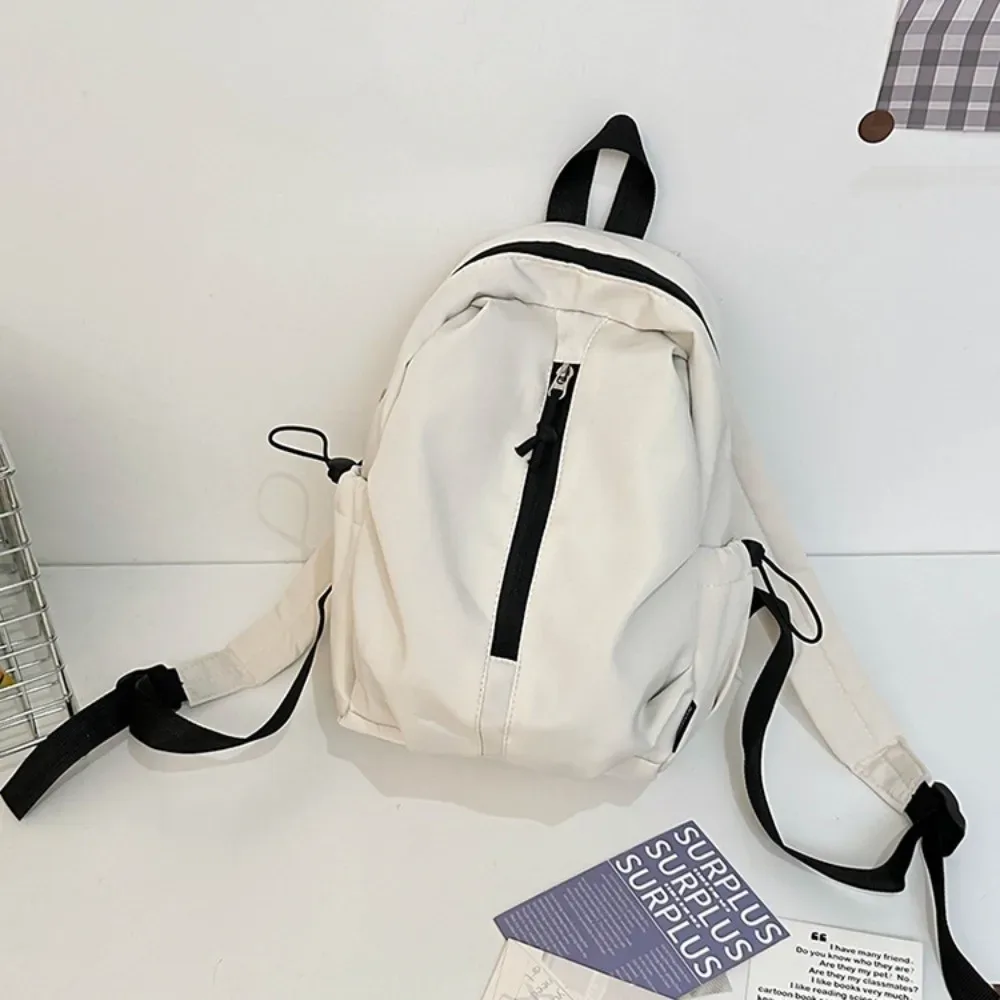 nouveau sac à dos simple de grande capacité, léger et étanche, sac à dos de randonnée avec fermeture éclair, couleur unie, sac d'université pour l'extérieur