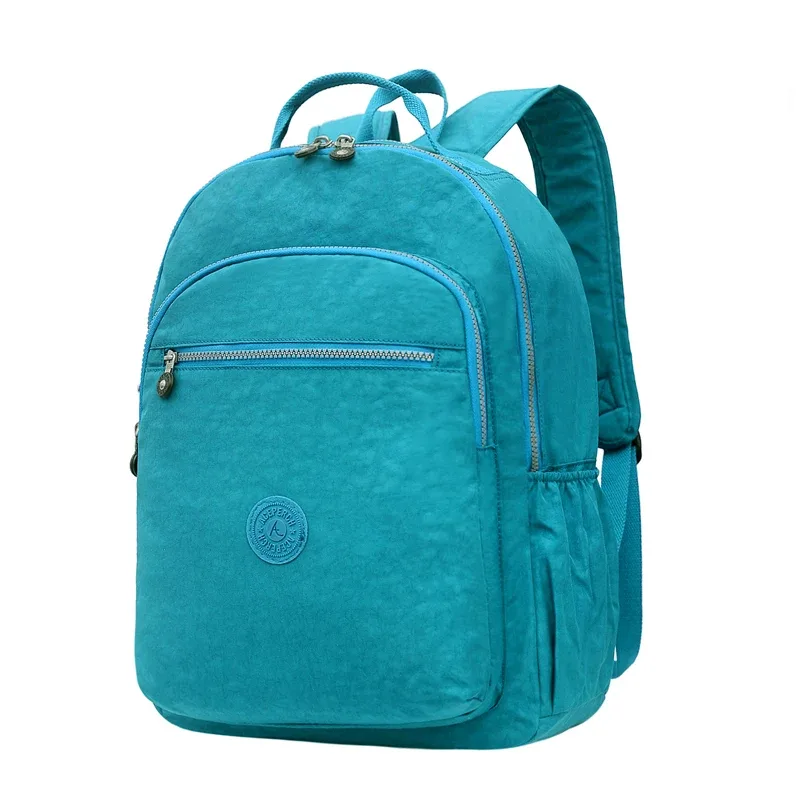 sac dos nylon gris anthracite compartiments poches latérales glissière accessoires pompon porte monnaie voyage école adolescente