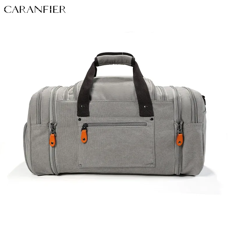 sac voyage toile gris poignée noire fermetures glissière orange intérieur marron compartiments extensibles polyvalents week end sport