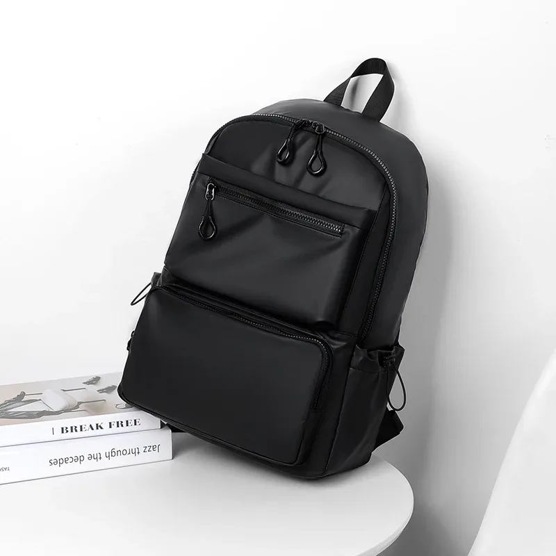 sac dos polyester noir motif rayé gris blanc compartiment ordinateur portable trousse toilette usage étudiant professionnel voyage