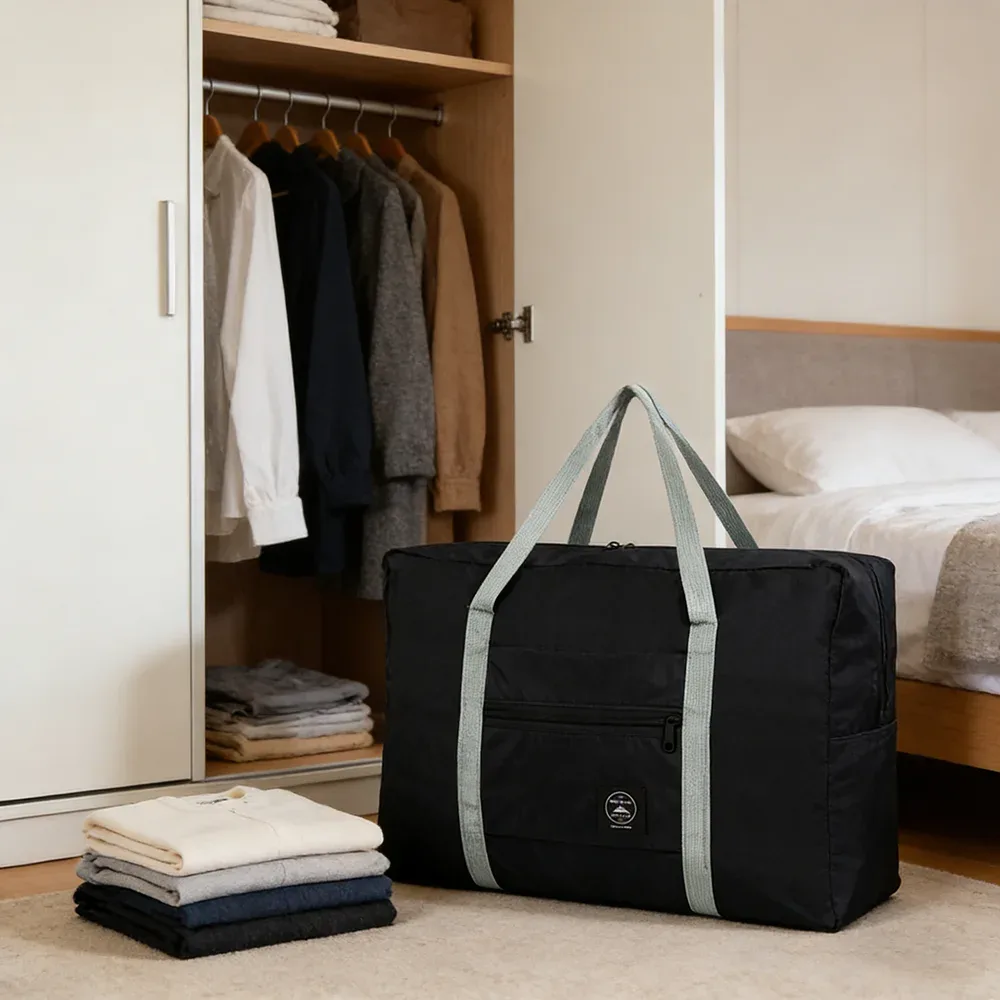 sac de voyage pliable de grande capacité, imperméable et résistant à l'usure, peut être porté à la main et stocké sur une épaule à la maison.