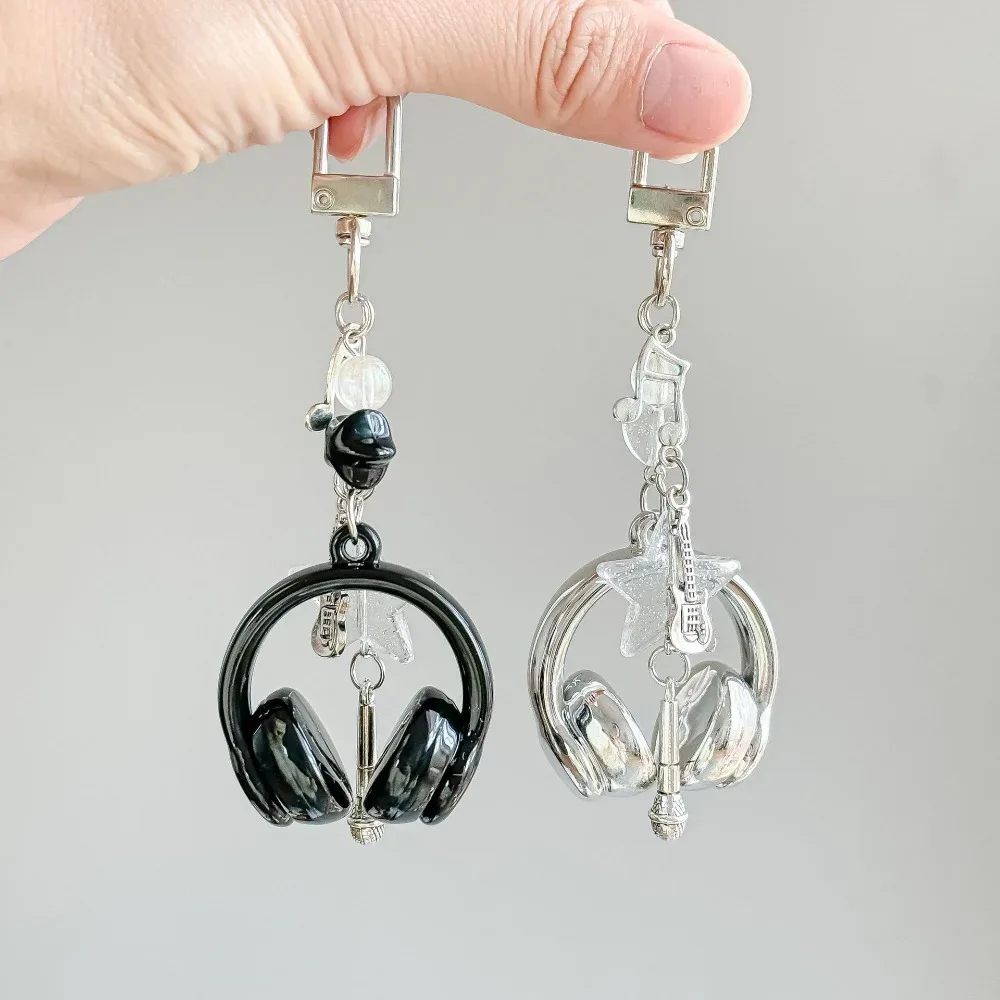 porte clé musical chaine métal accoutrements musicaux petit pendentif créatif voyage sac main pods casque bouton poussoir écouteurs accessoire voyage