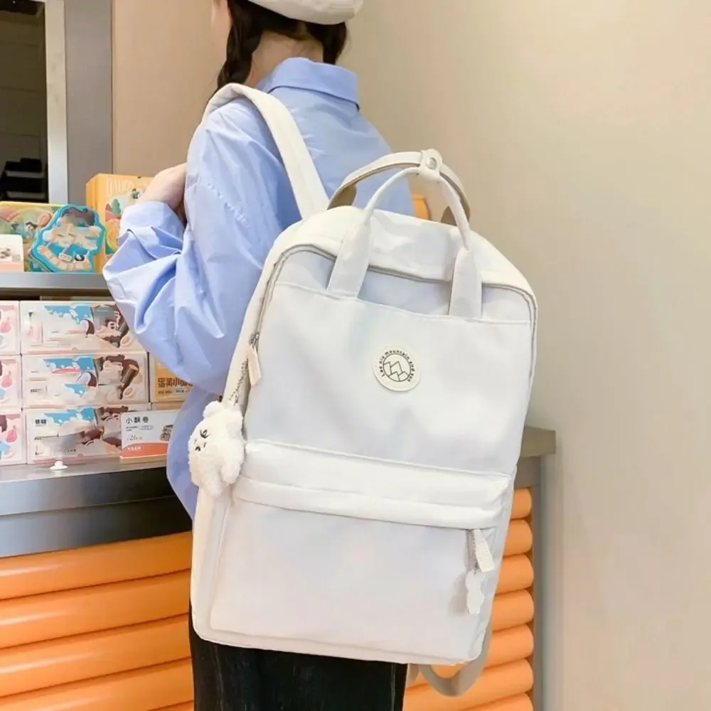 sac à dos léger et imperméable pour femmes, grande capacité, couleur unie, sac d'école en nylon, sac à dos ergonomique de voyage et de loisirs