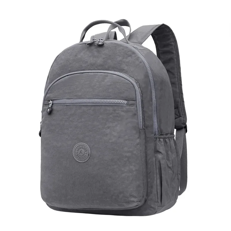 sac dos nylon gris anthracite compartiments poches latérales glissière accessoires pompon porte monnaie voyage école adolescente