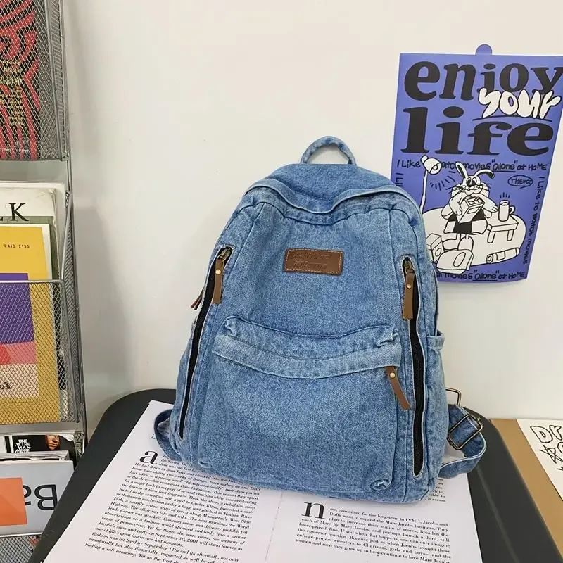 sac dos jean bleu denim poignée supérieure fermeture éclair compartiment intérieur usage étudiant voyage