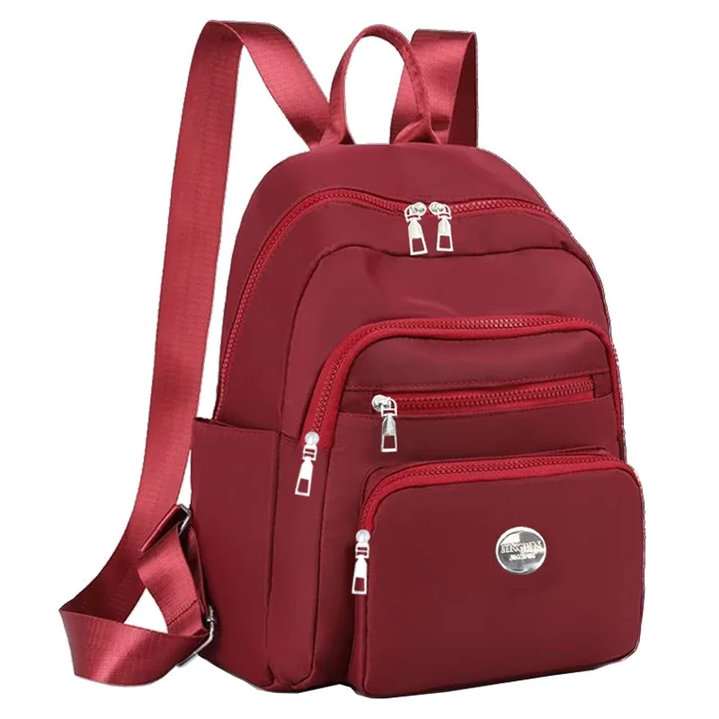 petit sac à dos noir et marron à motif quadrillé classique, plusieurs poches zippées, sac à dos décontracté et tendance, peut contenir un téléphone, des cosmétiques et des essentiels
