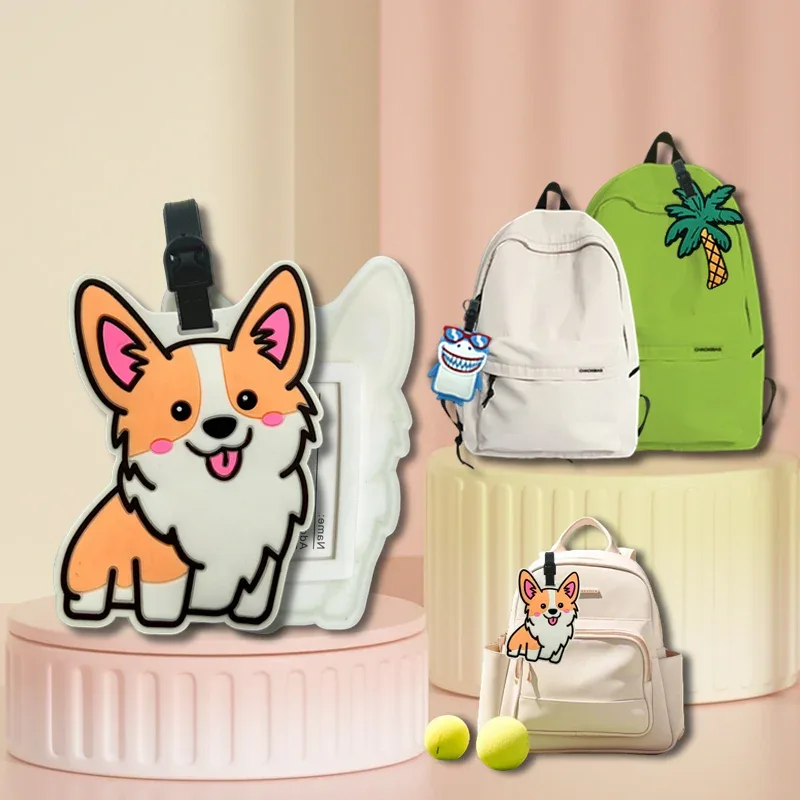 étiquette bagage plastique chien corgi peluche blanche orange yeux roses accessoire voyage identification valise nom adresse